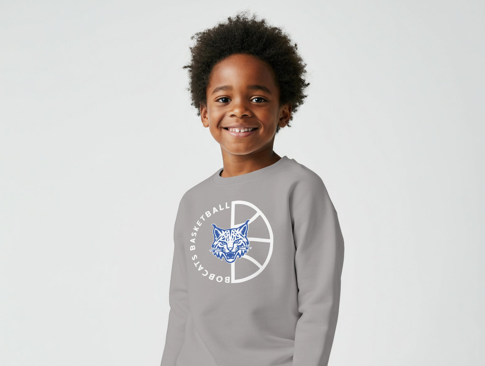 Child wearing a gray sweatshirt with a logo on a white background